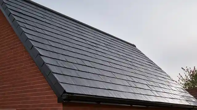 Roofing team working on a tiled roof